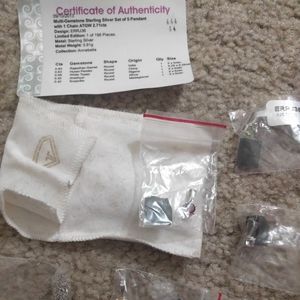 Certified small gems (5) in setting, w/necklace